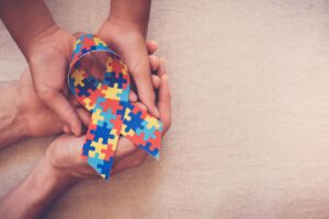 Puzzle autism hands ribbon